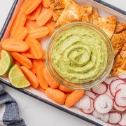 creamy avocado recipe with veggies and chips