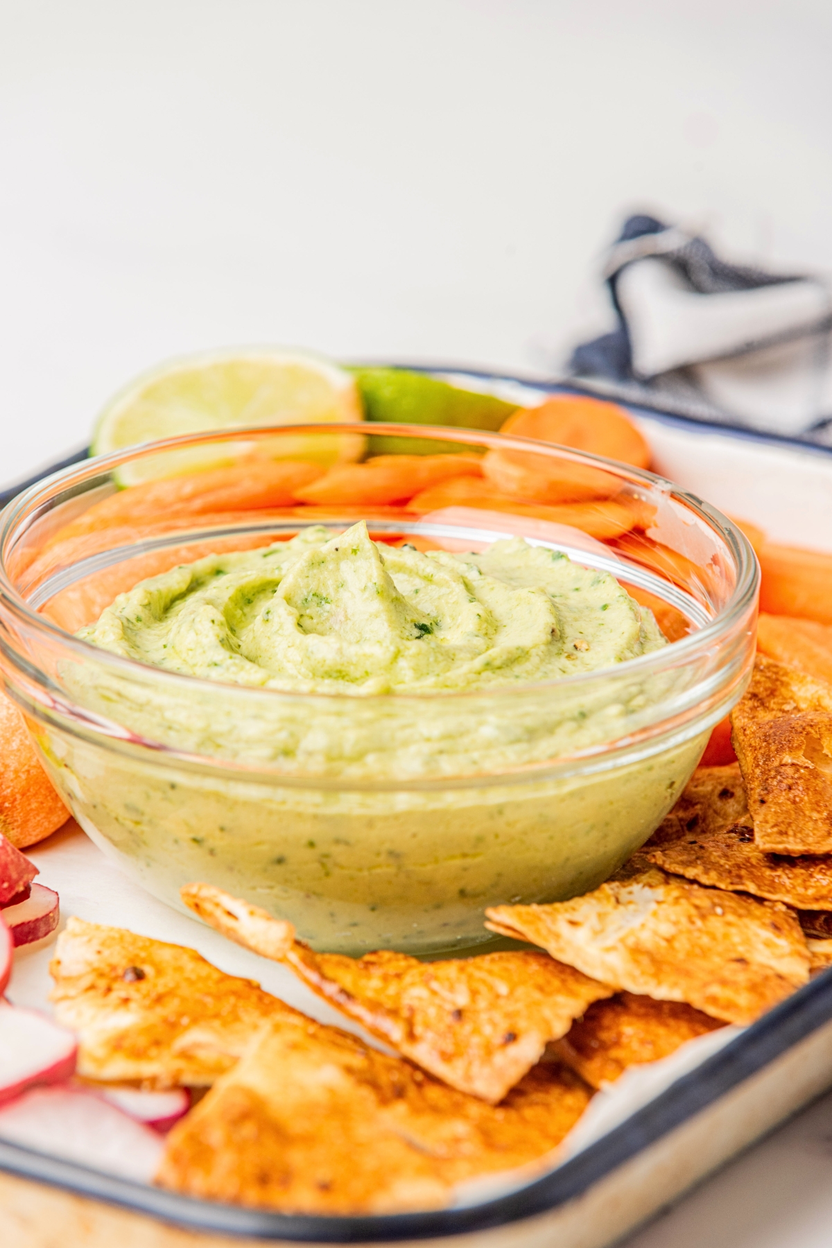 a glass bowl full of avocado sauce recipe