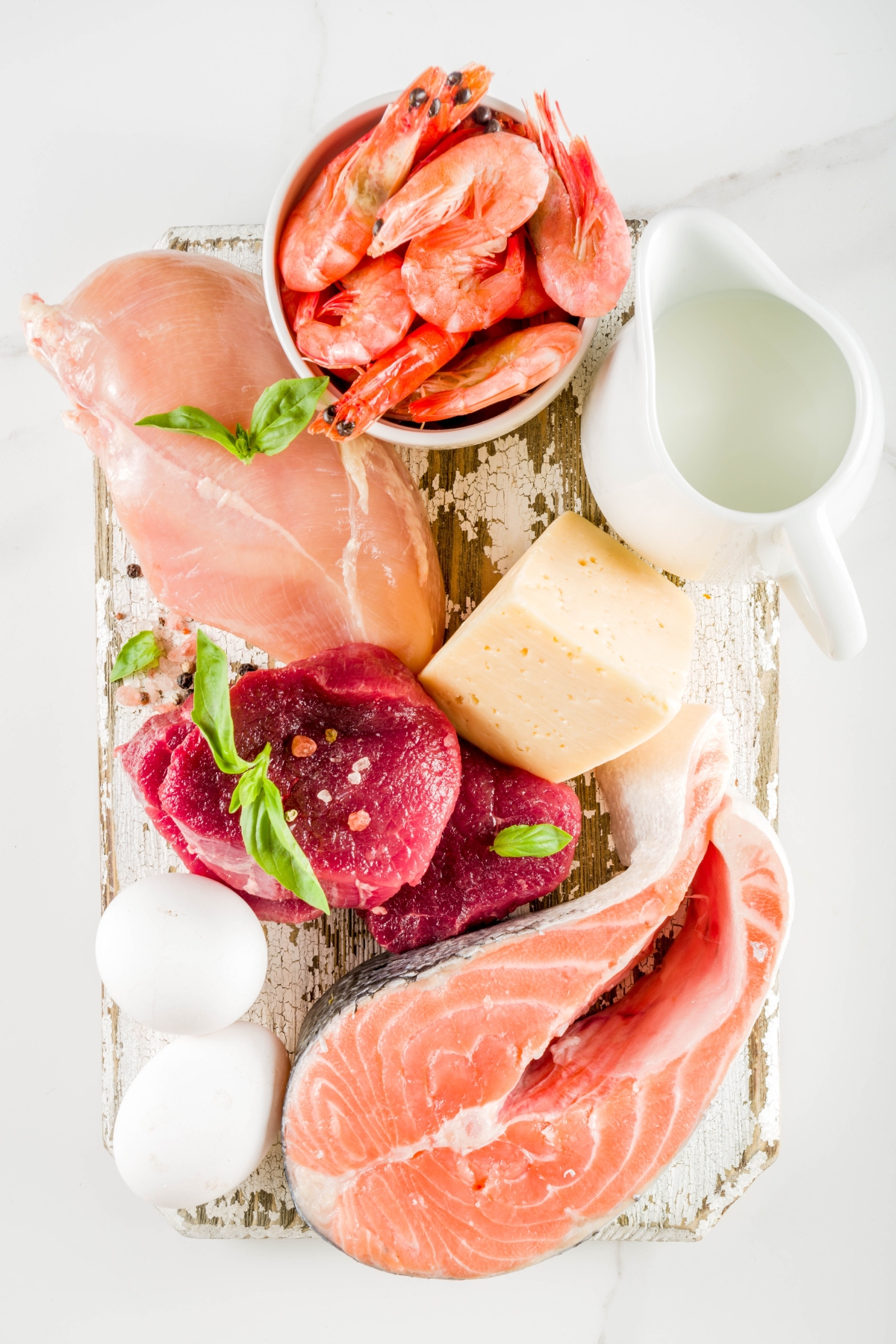 a variety of keto protein on a cutting board