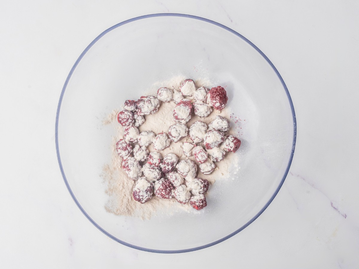 tossing fresh blackberries sugar and flour