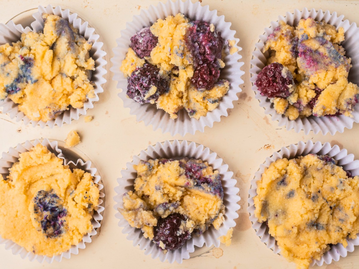 prepped muffin tin with muffin batter 