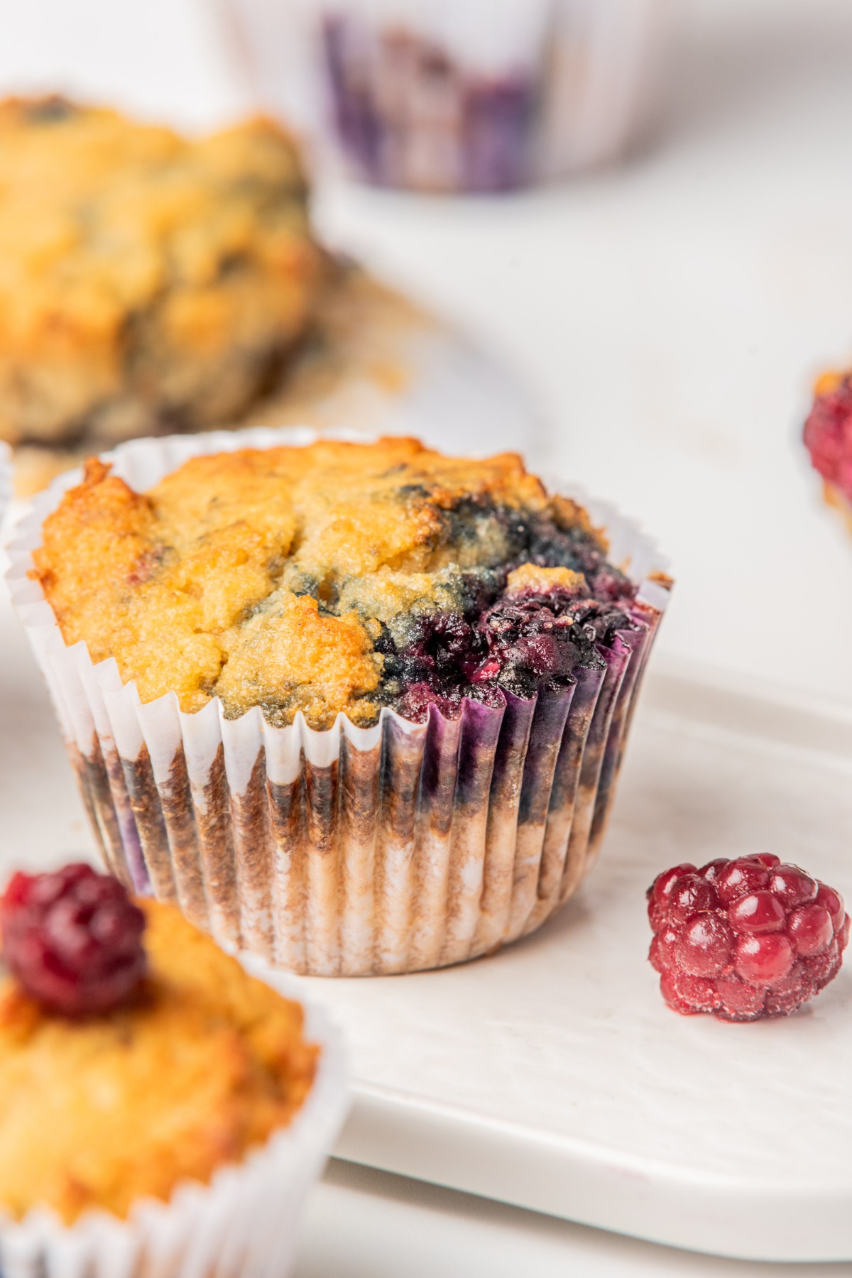 blackberry muffin on a white platter