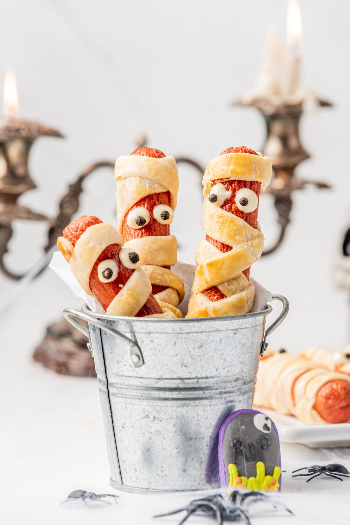 close up shot of halloween mummies made from hot dogs. 
