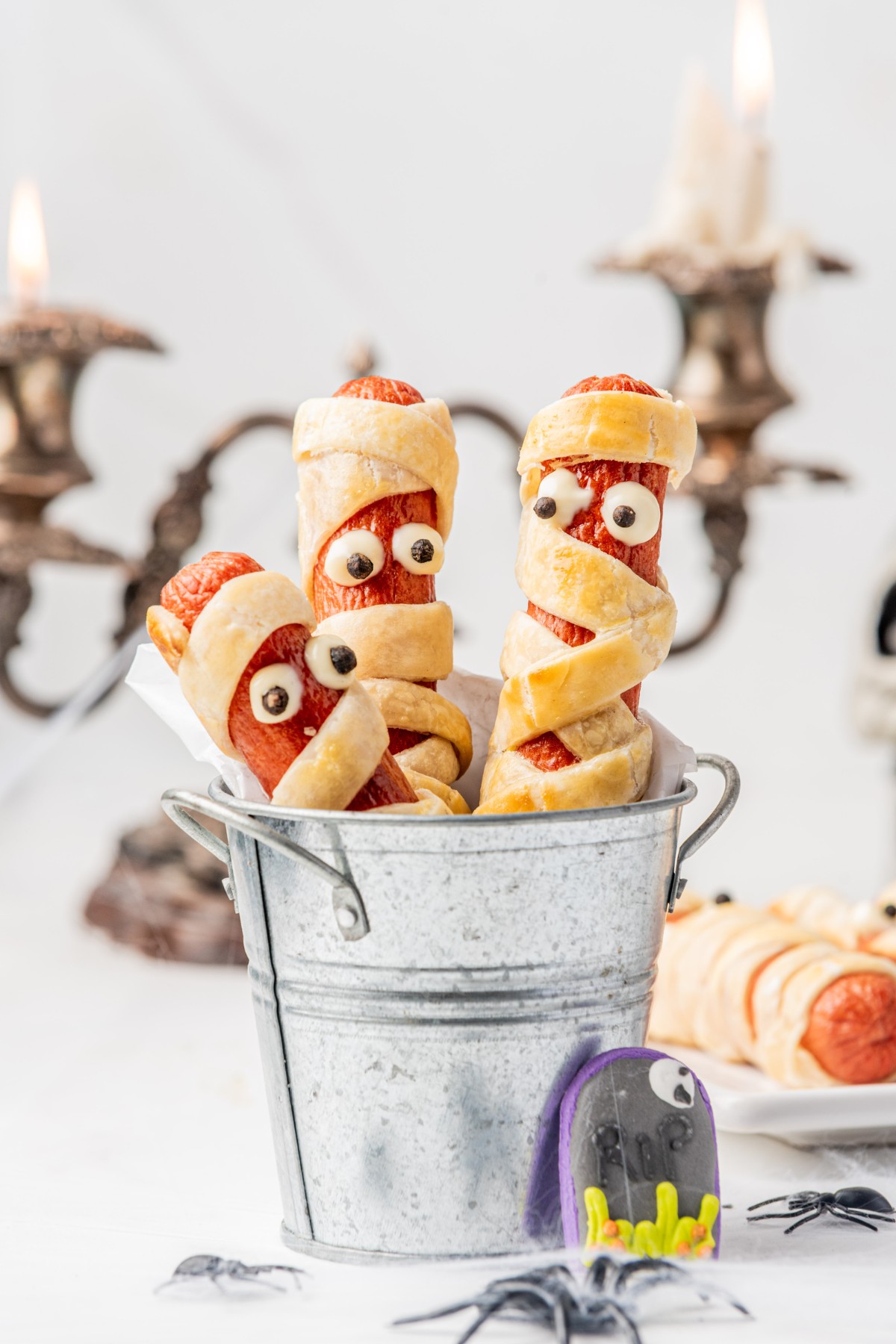 close up shot of halloween mummies made from hot dogs.