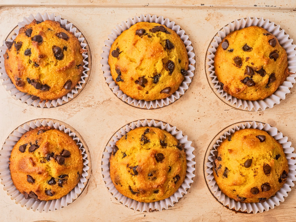 baked pumpkin chocolate chip muffins in a muffin tin