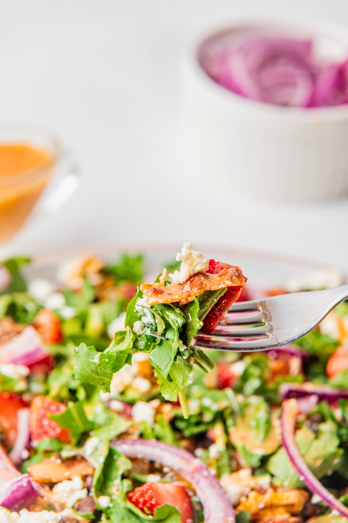 grabbing a bite of arugula goat cheese salad. 