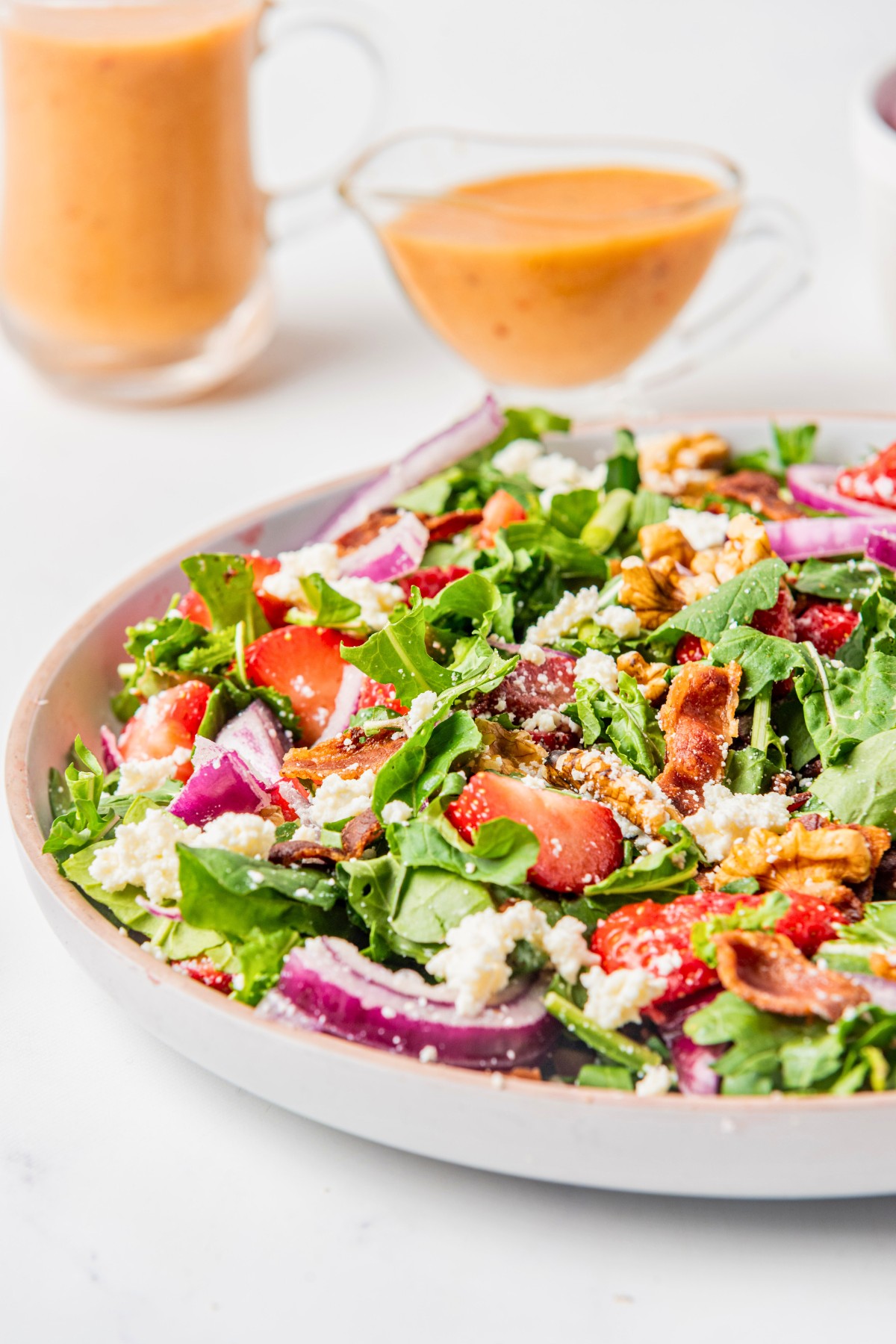 arugula salad tossed with walnuts and red onions. 