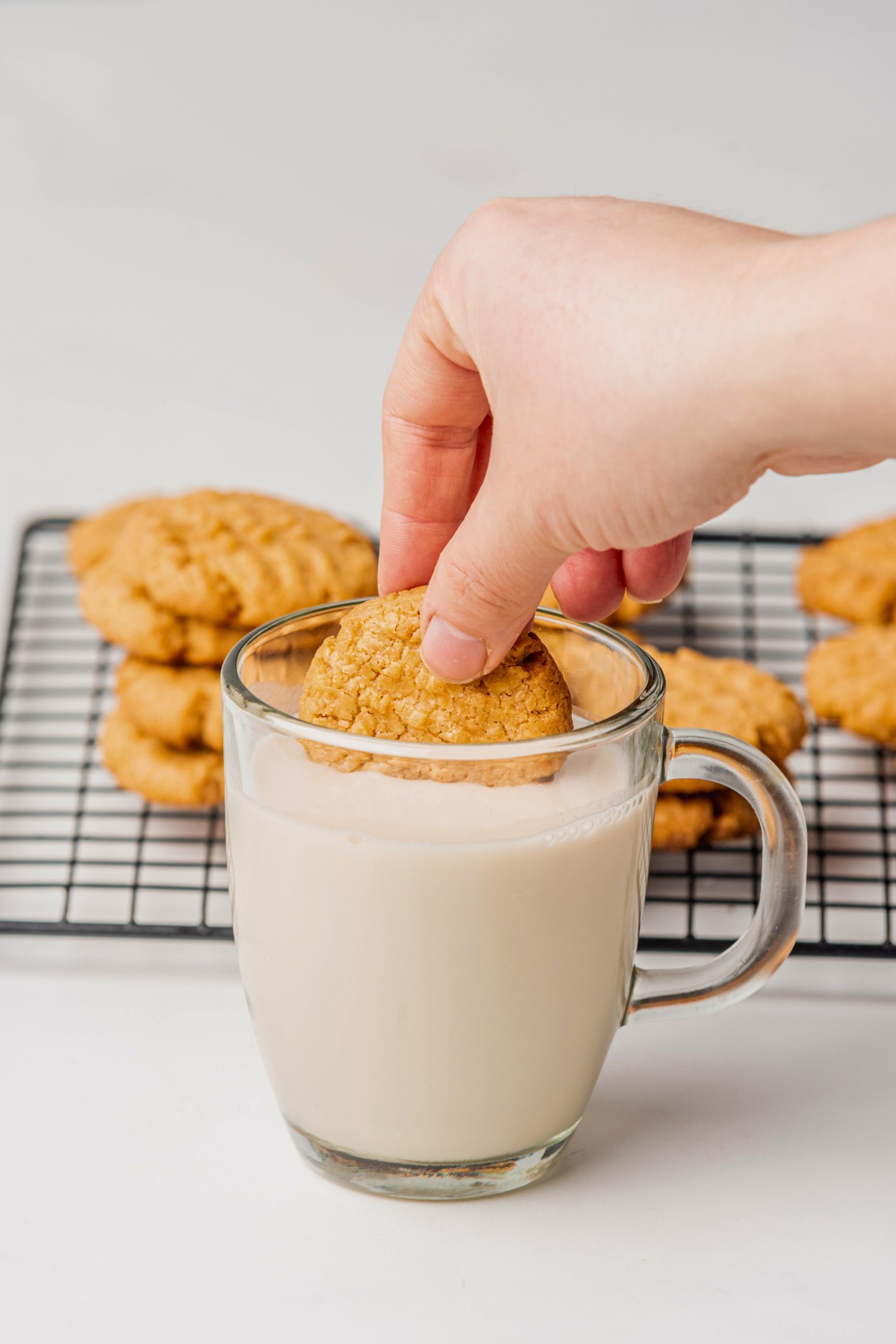 Dunking peanut cookies into almond milk. 