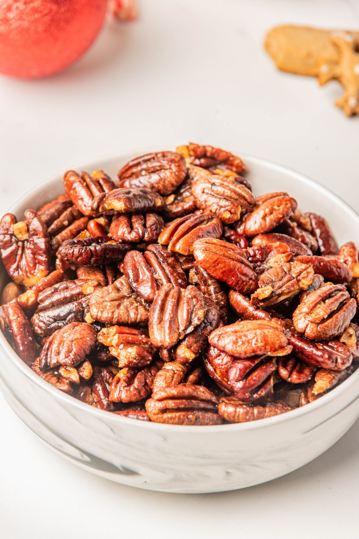 silver bowl of keto candied pecans