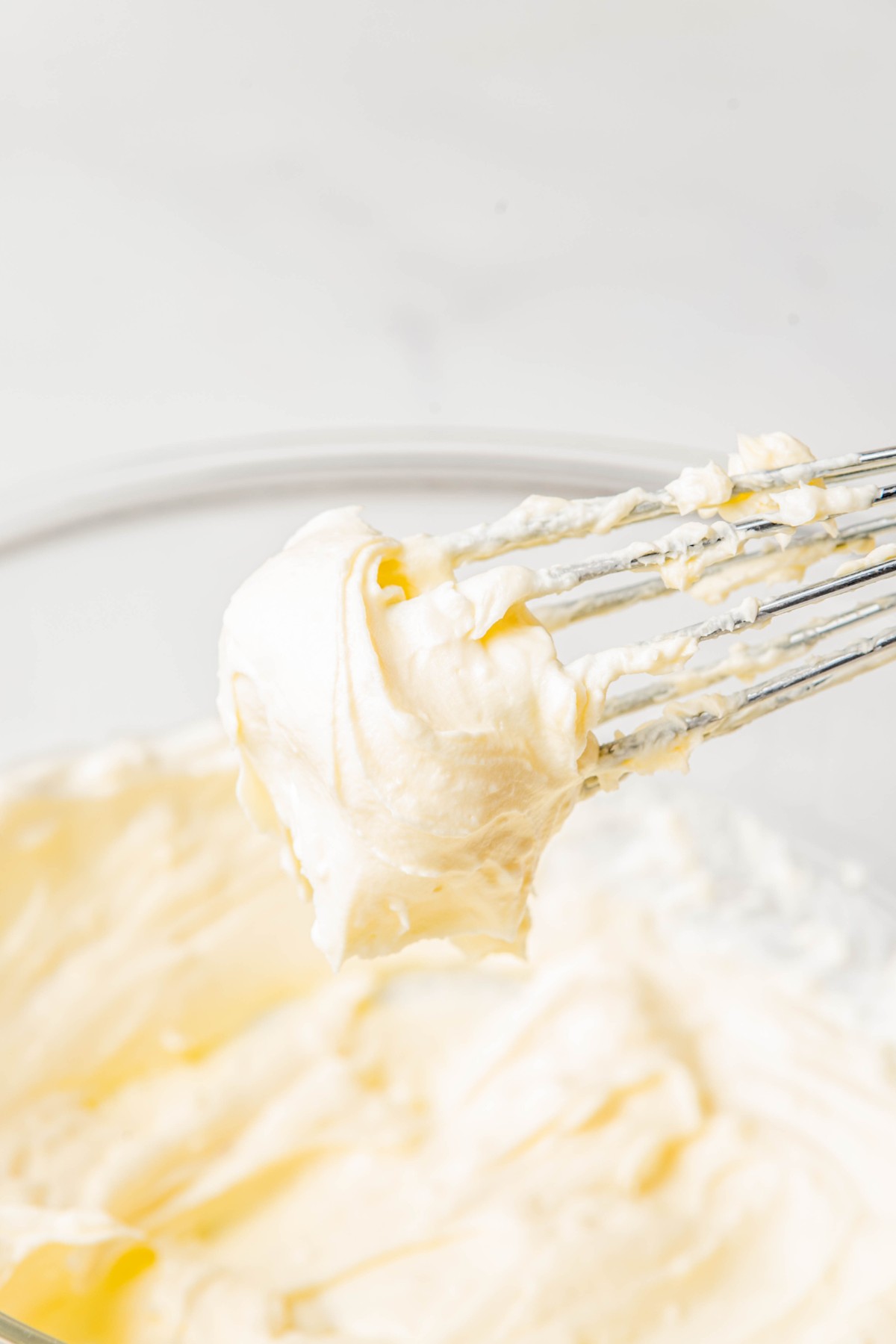 whipped cream cheese on a whisk