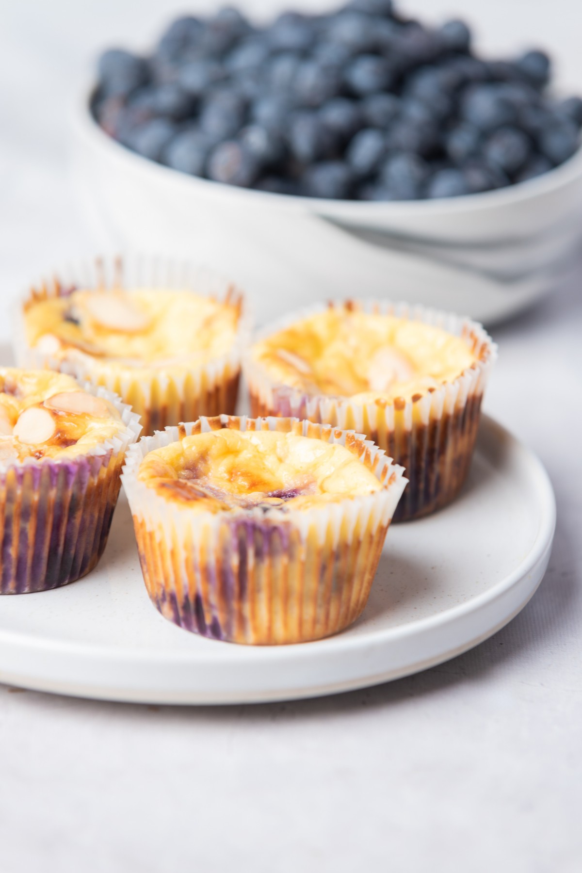 blueberry cream cheese muffins on a plate