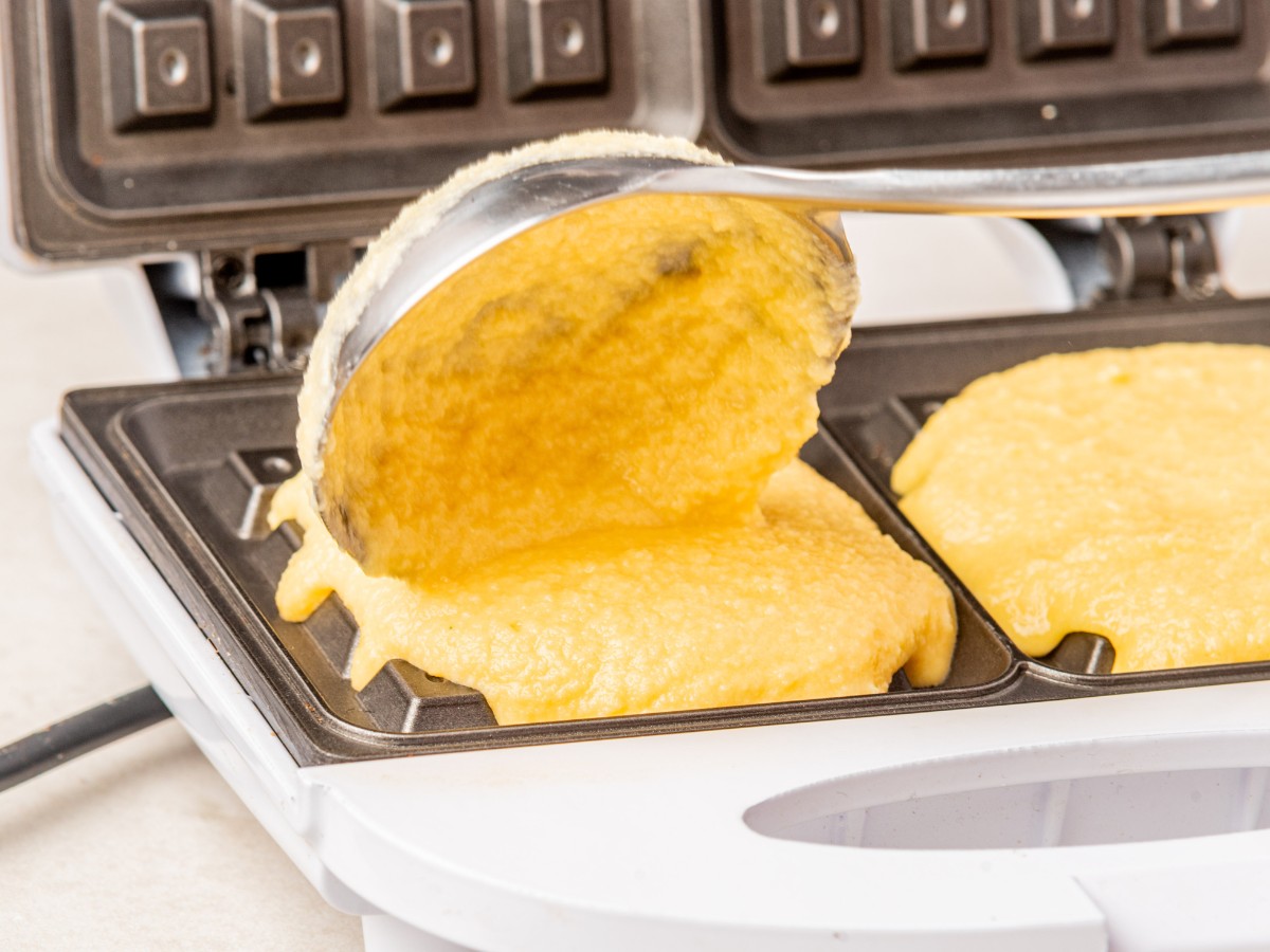 scooping batter into waffle iron