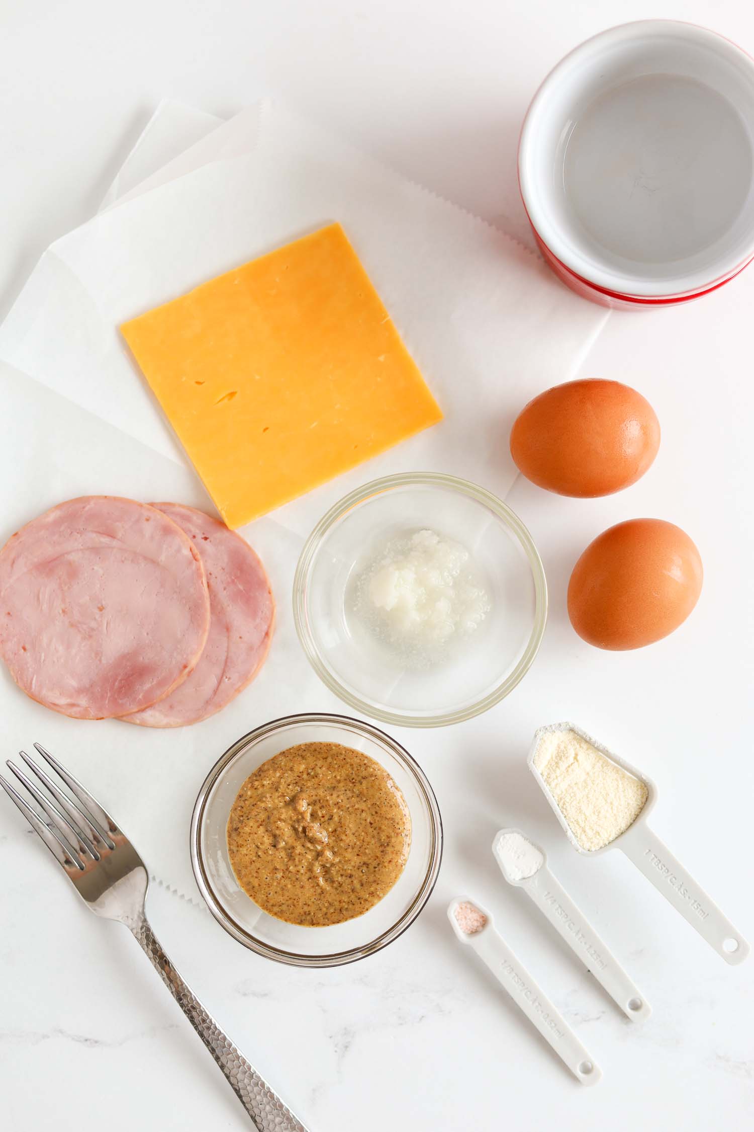 overhead shot of ingredients to make keto mcdonald's egg mcmuffin.