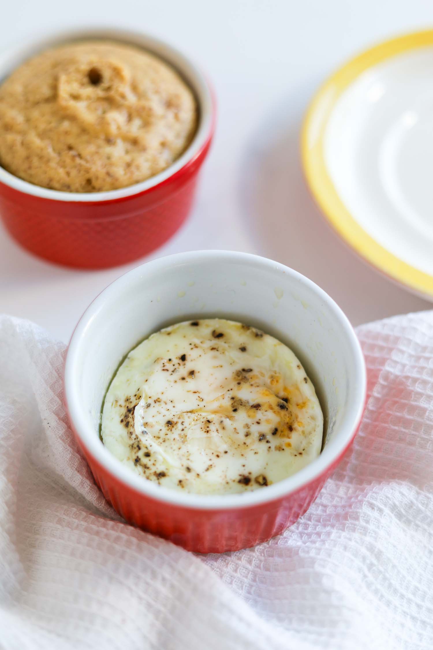 egg in ramekin after cooking in microwave.