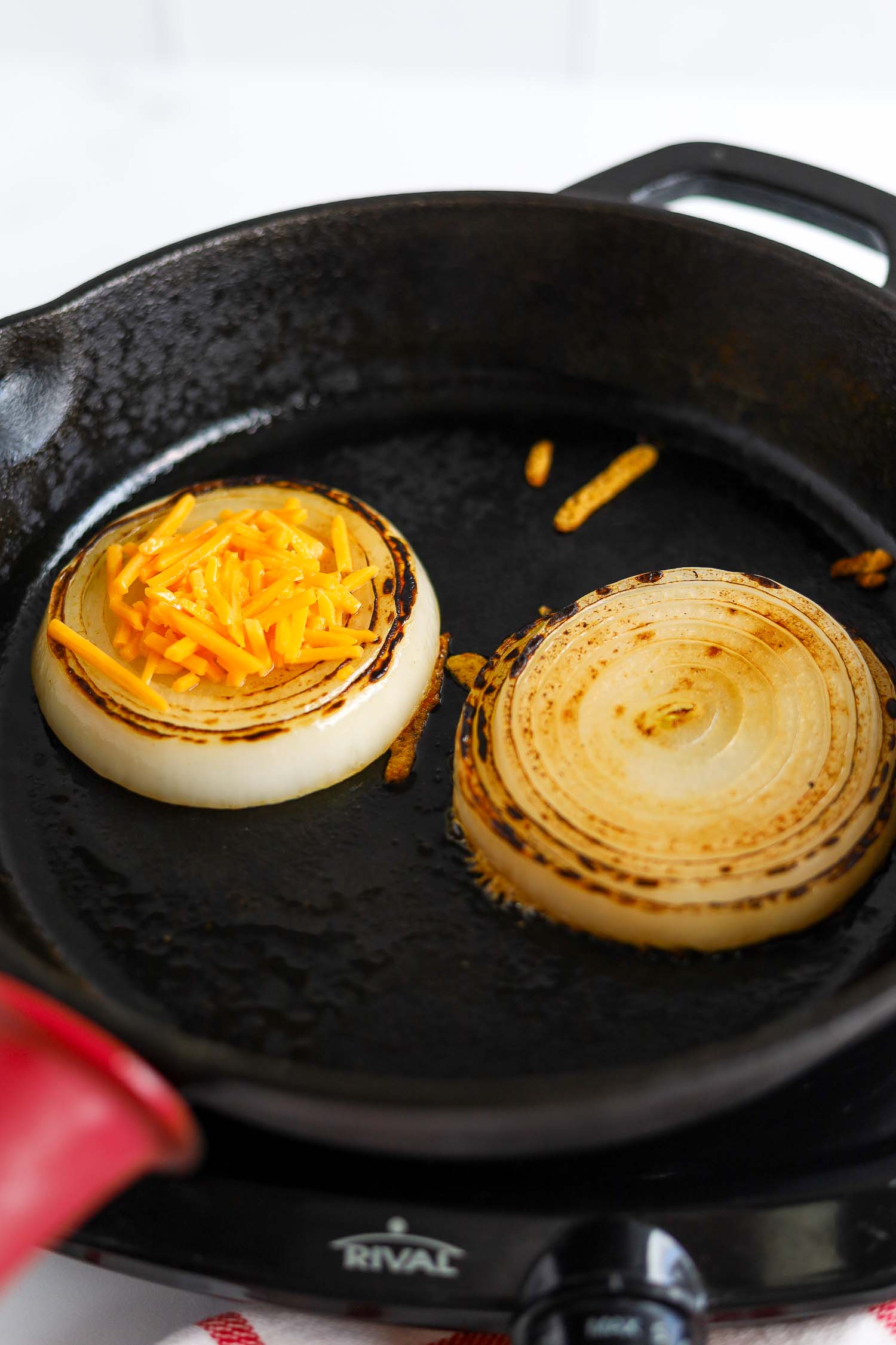 grilling onions in a cast iron skillet