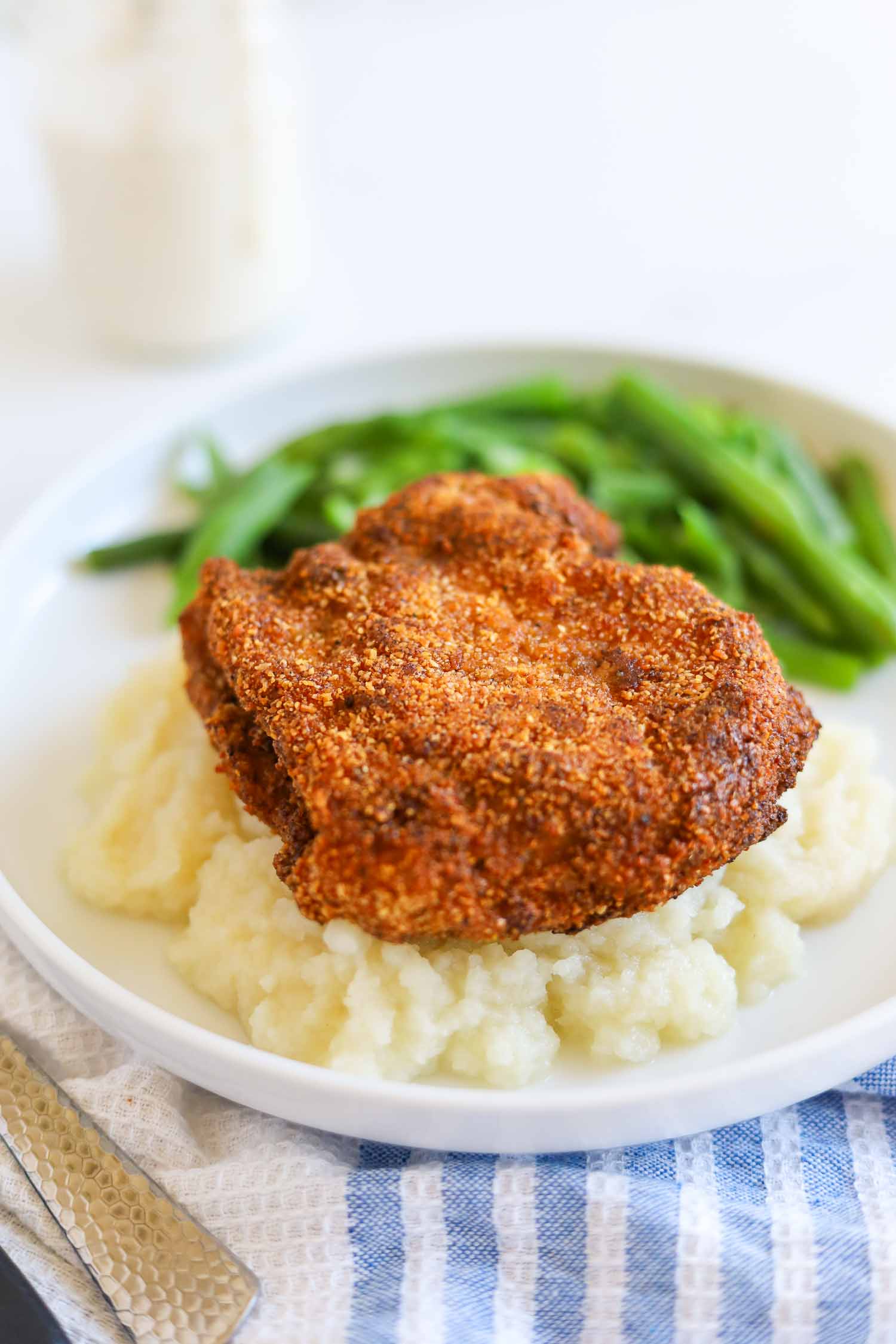 serving chicken fried steak with cauliflower mash