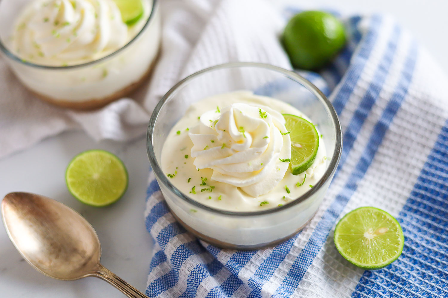 low carb key lime cheesecake with lime zest and whipped cream 