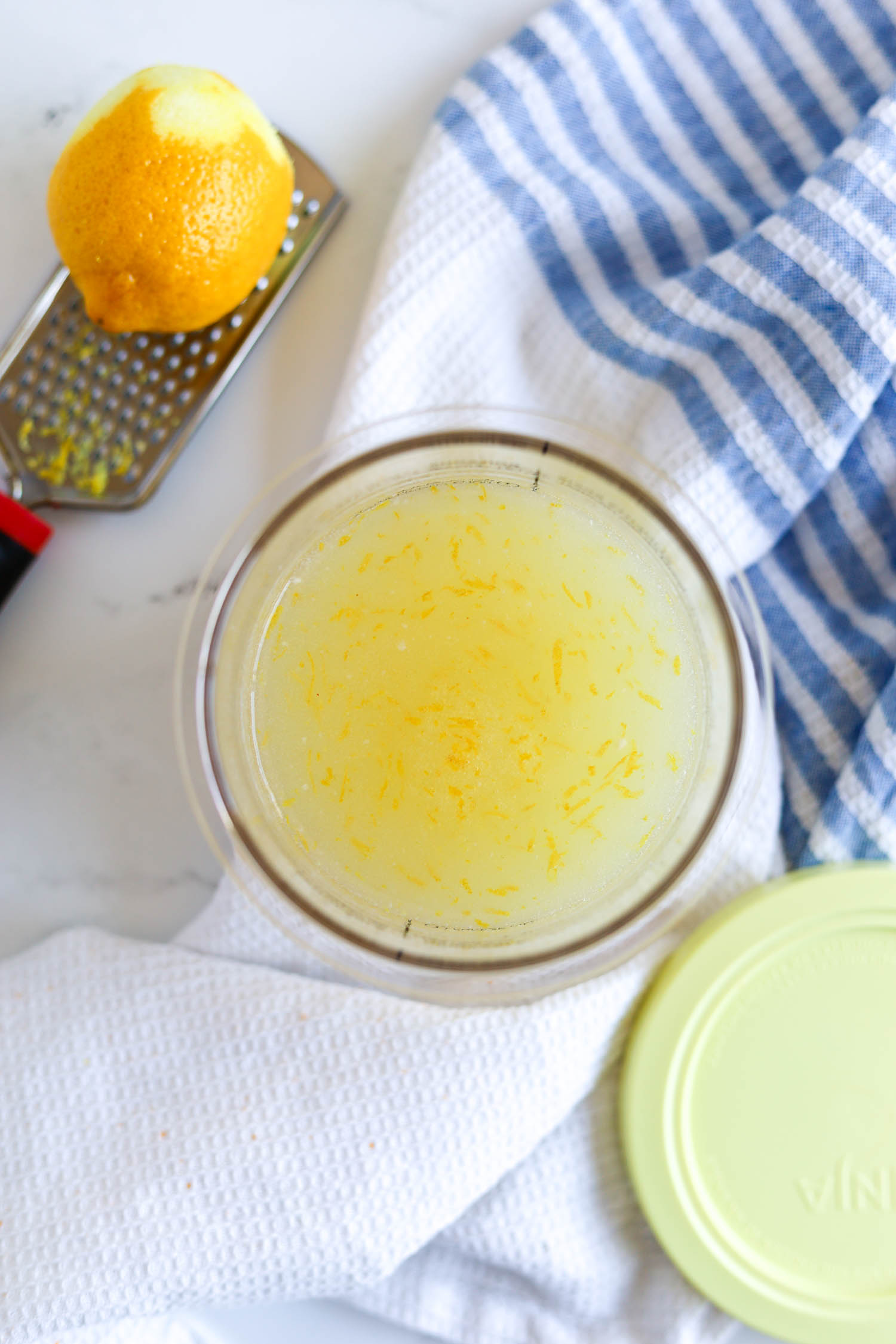 adding lemon zest to lemon juice