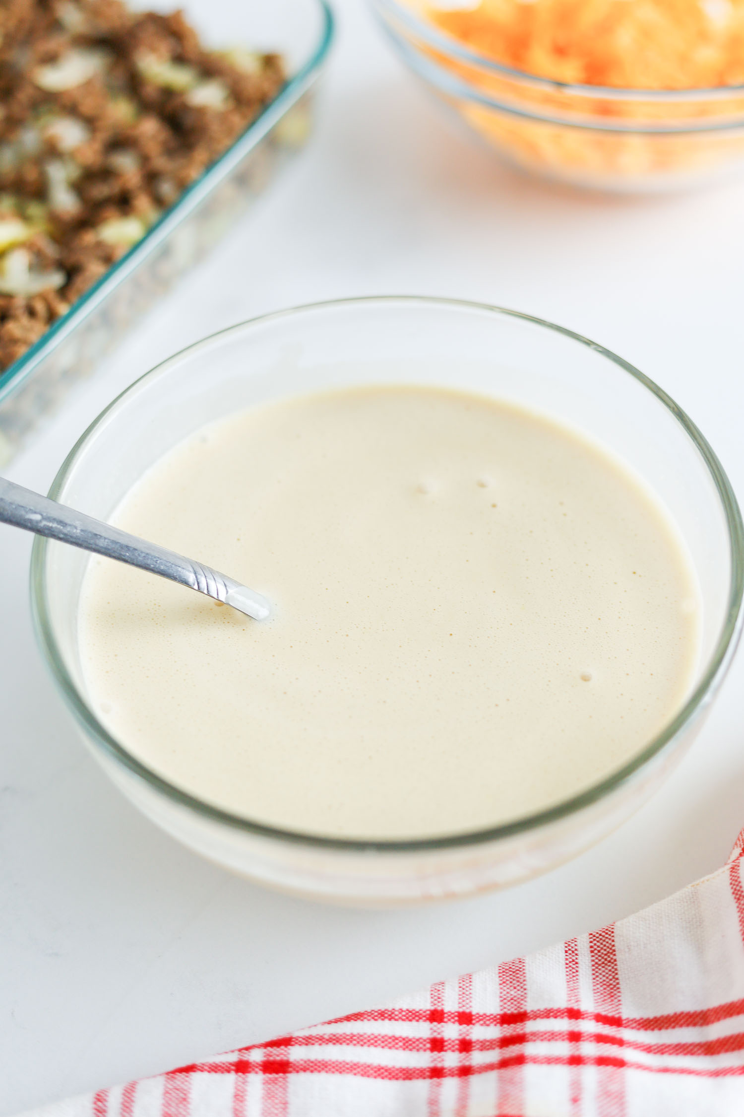 mixing egg mixture with heavy cream 