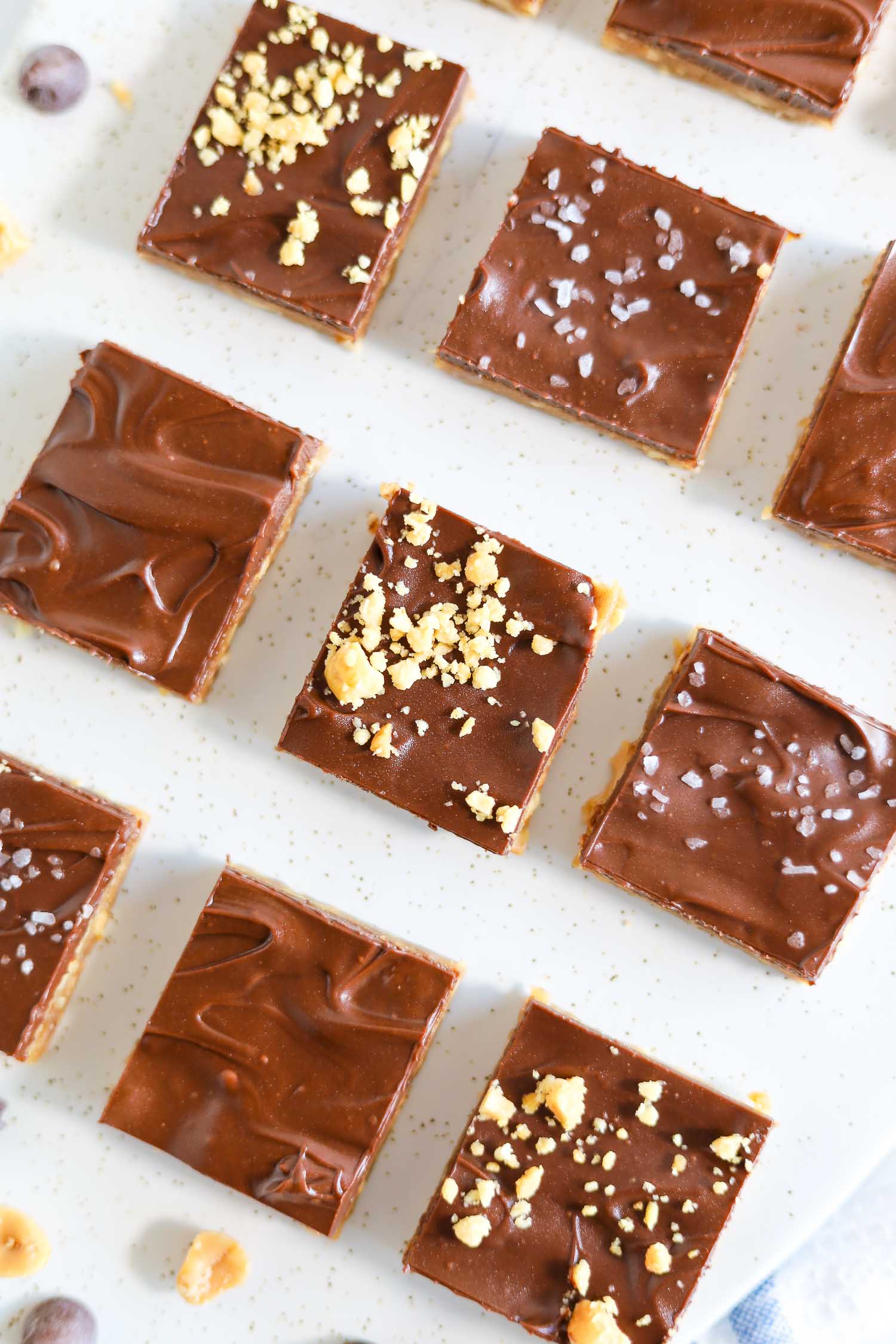 cut up snickers bars topped with sea salt and chopped peanuts 