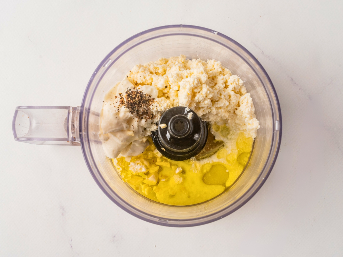 adding the dip ingredients to food processor 