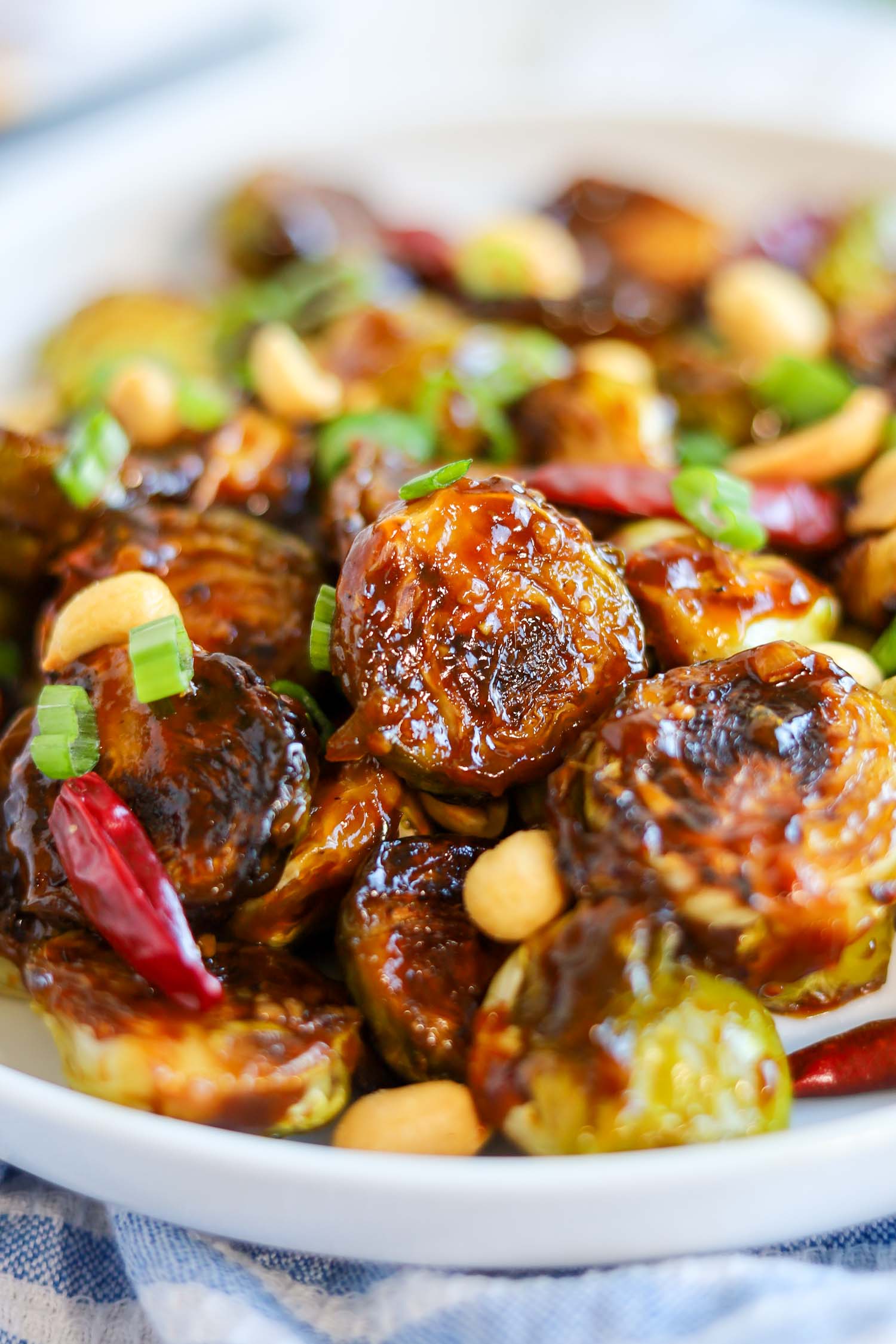 close up of roasted brussel sprouts with sauce