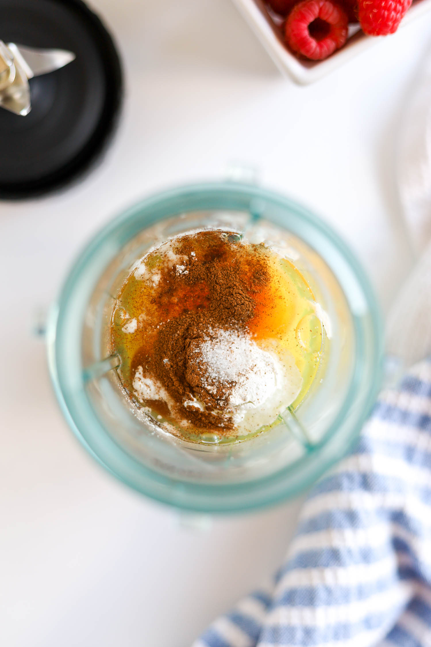 adding pancake ingredients to a blender