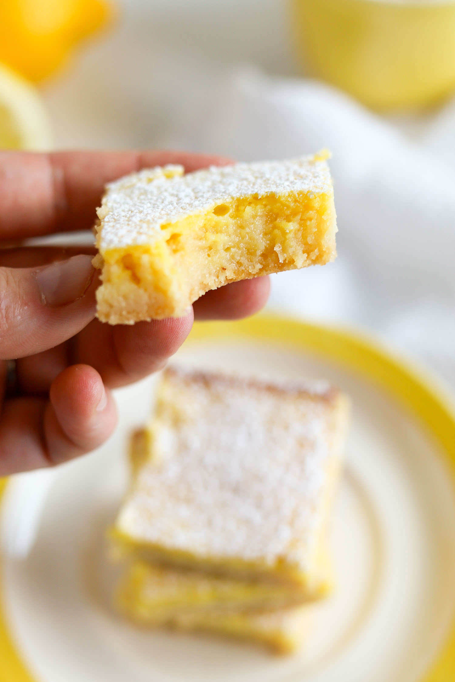 taking a bite out of a low carb lemon bar