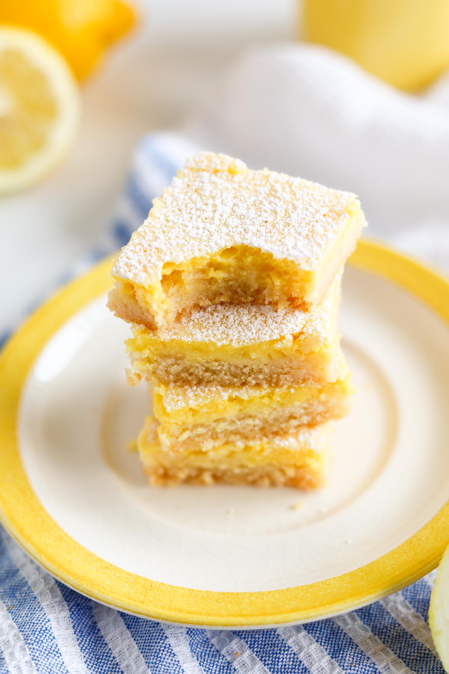 sugar free creamy lemon bars with a bite taken out of it
